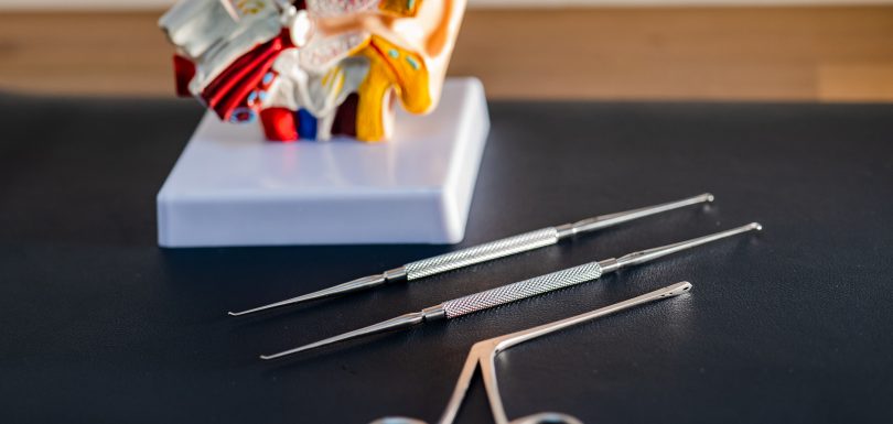 ear wax removal tools with an anatomical ear model at Kensington Hearing