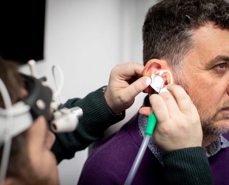 Audiologist performing professional microsuction ear wax removal at Kensington Hearing London.